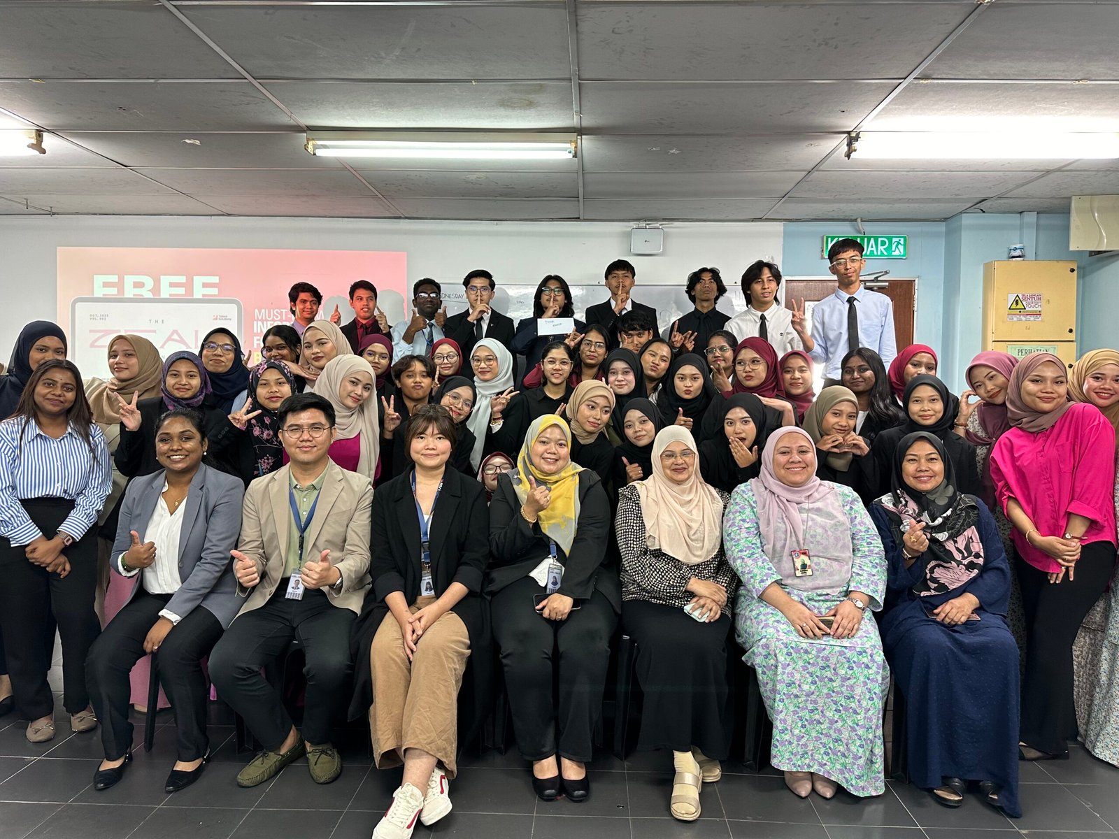 A large group of diverse individuals posing together in a professional setting.