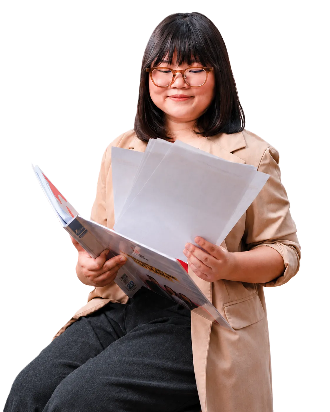 A woman reviewing documents with a focused expression, seated and holding papers.