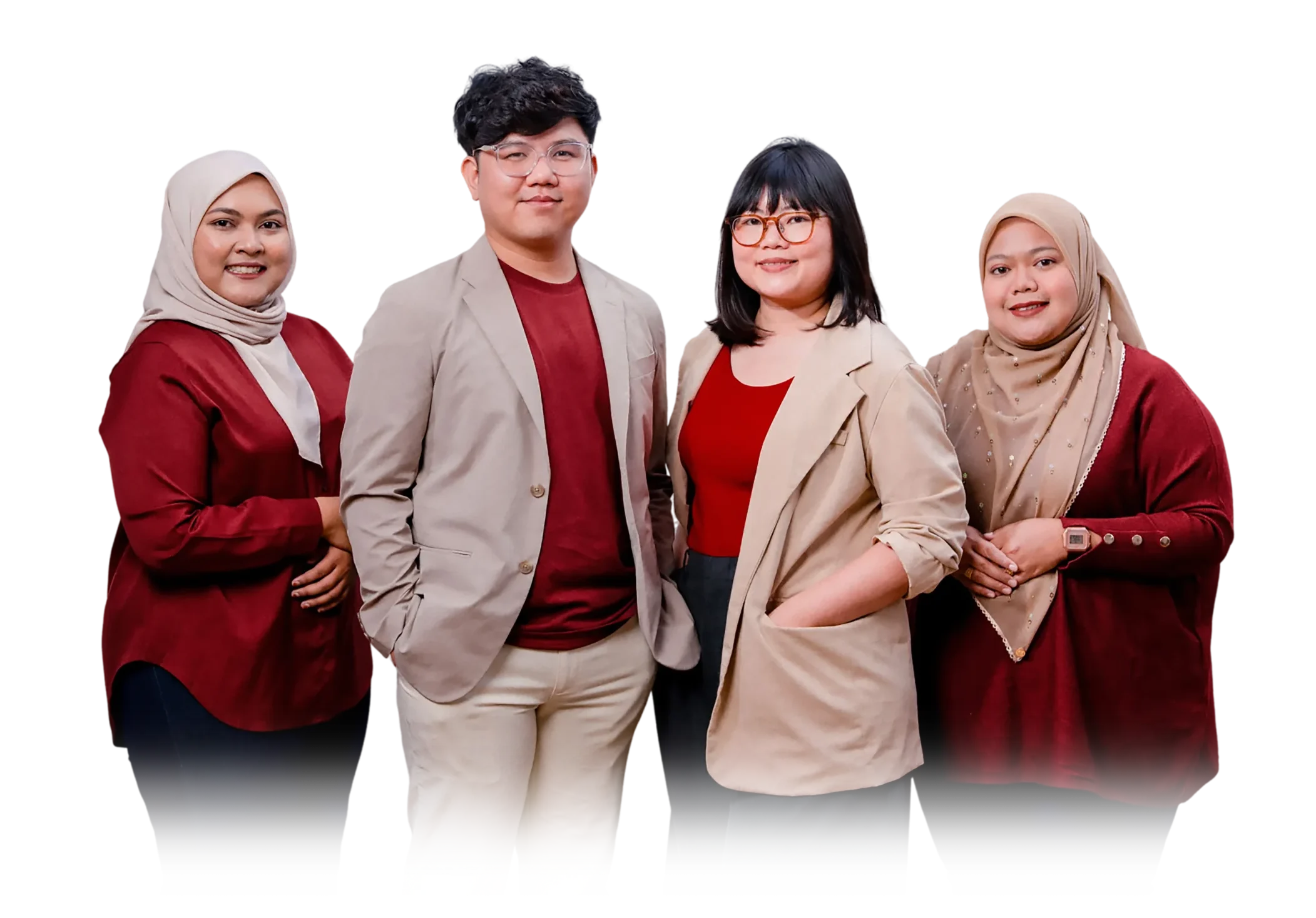 A group of four diverse professionals posing together, smiling, wearing business attire.