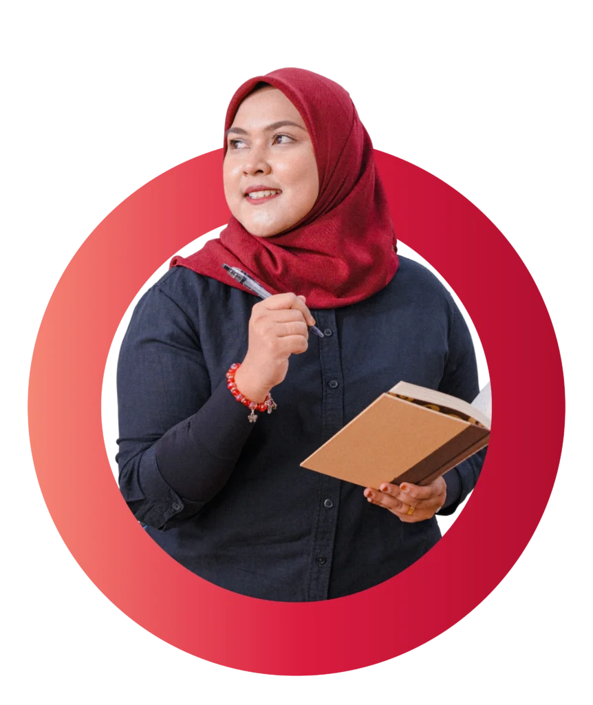 A team member posing with a friendly smile, wearing a blazer.